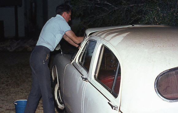 Charlie Watson washing his Jaguar