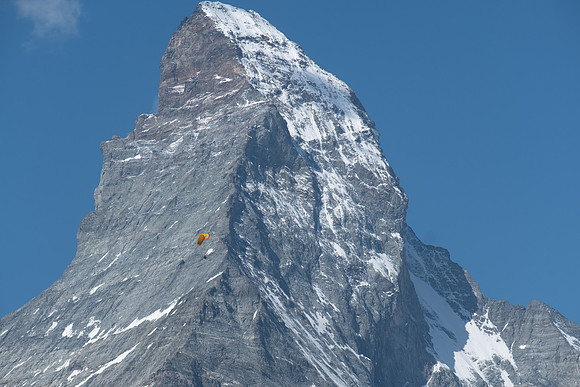 A Hanglider passes the Matterhorn