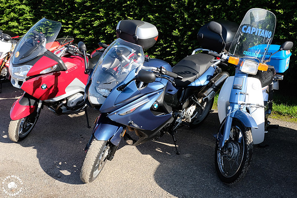 Ill just squeeze in here so the owner of the blue bike wont get out !